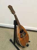 A Brambilla mandolin with ribbed silver wire strung back and tortoiseshell and mother of pearl