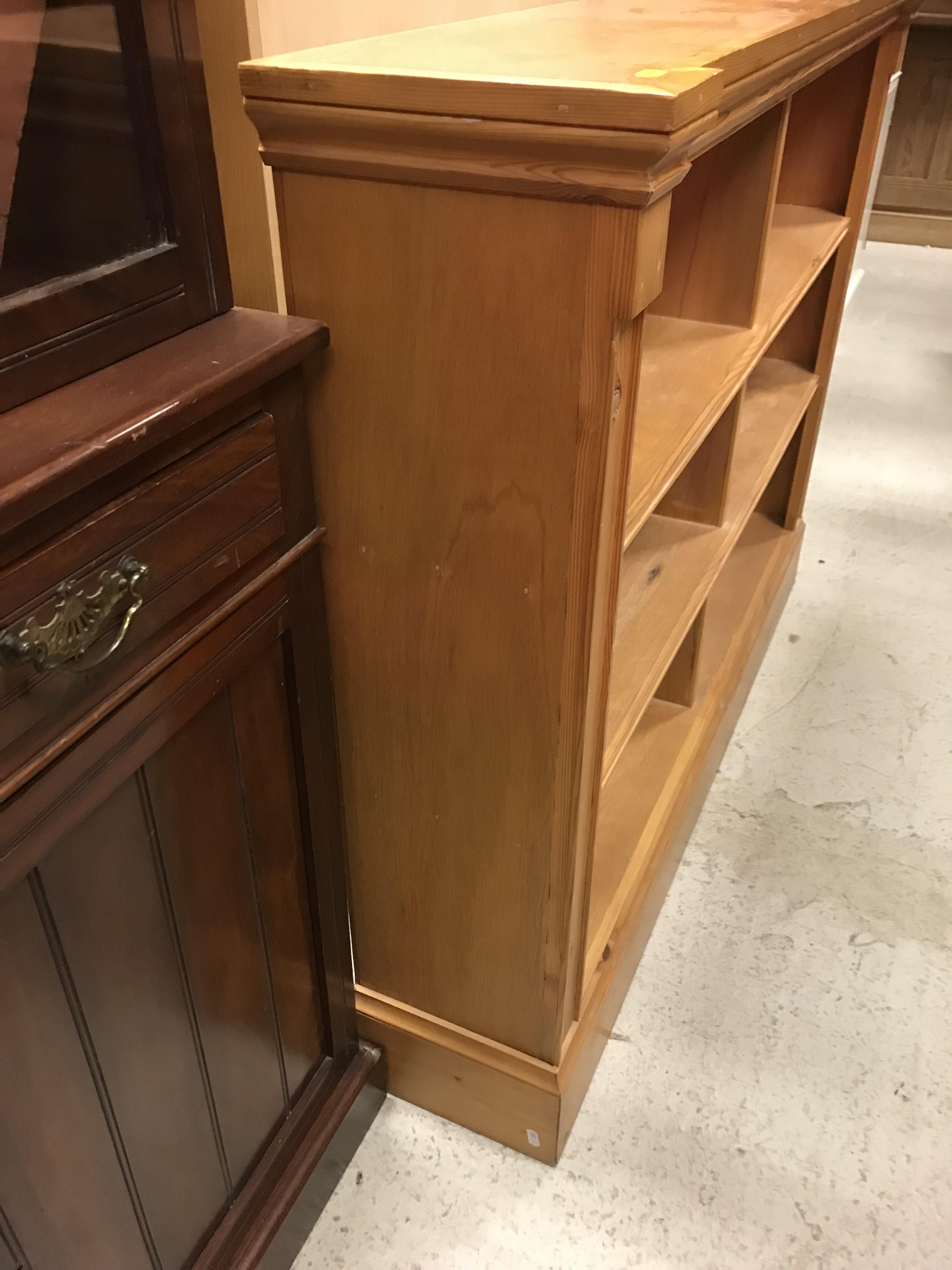 A pair of modern stained pine open bookcases of two banks of three shelves, raised on plinth bases, - Image 11 of 15