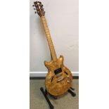 A burr maple bodied cut away guitar unnamed