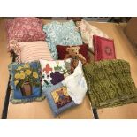 Two boxes of assorted scatter cushions to include needlepoint examples and a modern Indian style