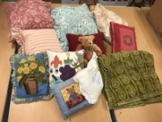 Two boxes of assorted scatter cushions to include needlepoint examples and a modern Indian style