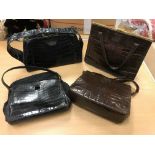 Four mid 20th Century crocodile skin handbags each bearing initial