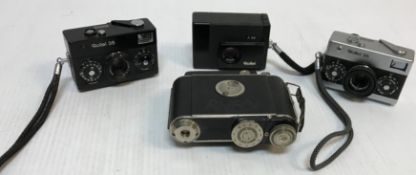 Three various Rollei cameras including a Rollei 35 black cased, a Rollei 35 chrome and black cased,