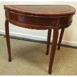 A modern Indian rosewood foldover tea table of demi lune form on shallow moulded cabriole legs 91