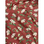 A pair of Jane Churchill red ground floral decorated cotton interlined curtains with fixed double