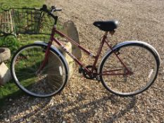 A Ranger Alpine ladies bicycle with basket with Shimano Index and XRM seat together with two iron