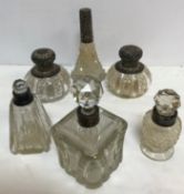 A pair of Victorian silver mounted cut glass scent bottles (by William Harrison Walter,
