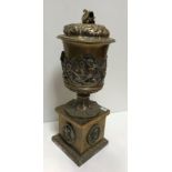 A late 19th Century plated lidded urn, the lid with swan finial and acanthus leaf decoration,