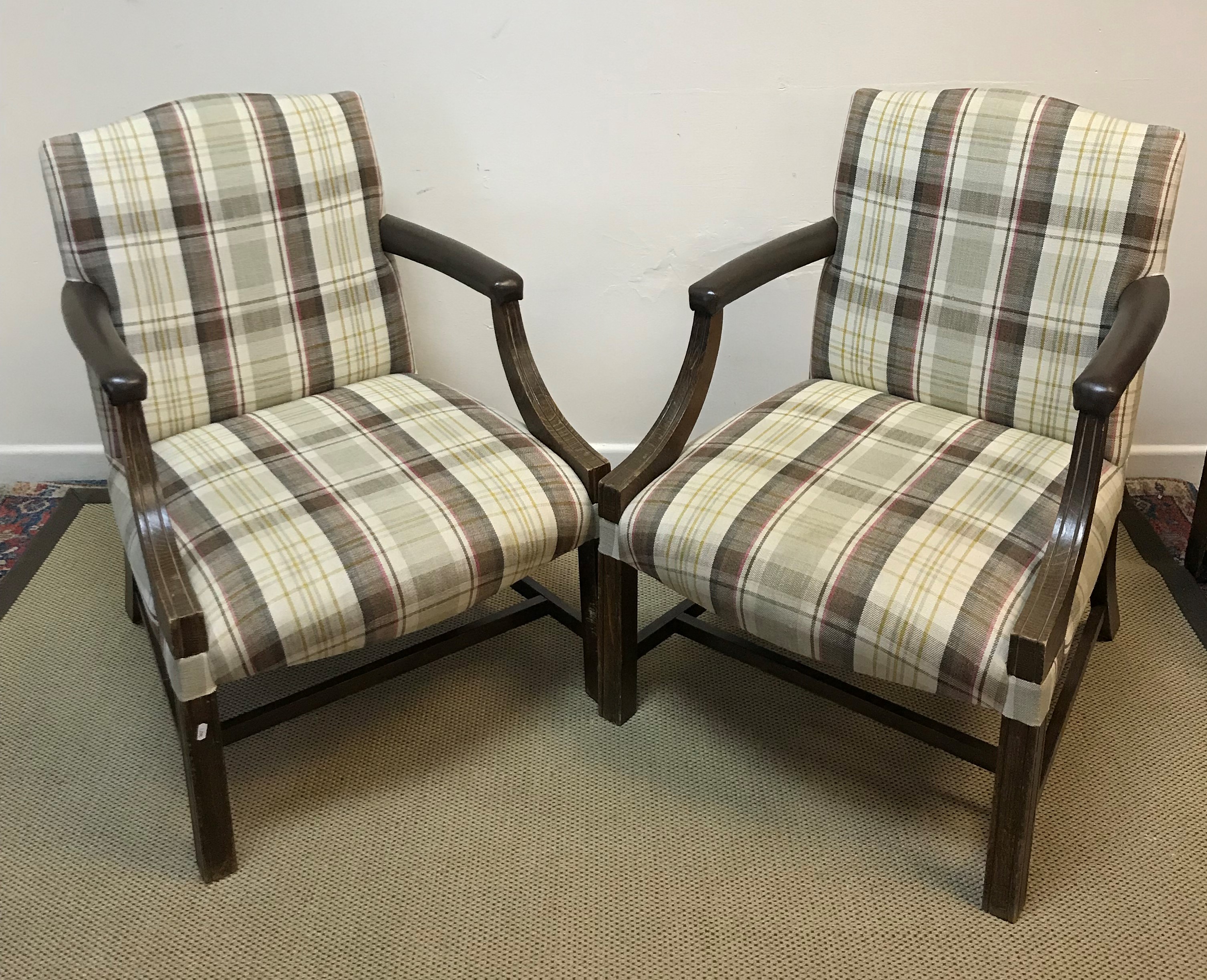 A pair of modern beech framed Gainsborough type armchairs with check upholstered back and seat and