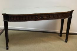 A 20th Century mahogany serving table in the Adam taste,