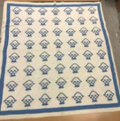 A circa 1900 blue and white basket pattern quilt,