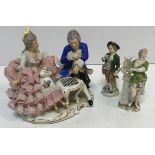 A Dresden Capo di monte figure group of "Couple seated at a games table", 18 cm wide x 16.