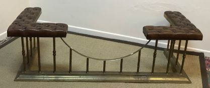 A circa 1900 brass railed club fender with brown buttoned leather upholstered end seats,