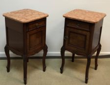 A pair of French mahogany marble top bedside or pot cupboards,
