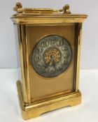 A circa 1900 French lacquer brass cased carriage clock,