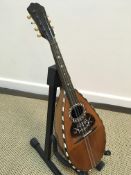 A Marco Rebora of Napoli mandolin with rosewood and satinwood strung back and mother of pearl