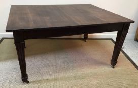 A mahogany rectangular extending dining table with reeded edge on square fluted and tapered legs to