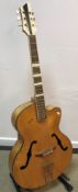 A mid-20th Century Posetti faux mother of pearl embellished violin bodied jazz guitar with