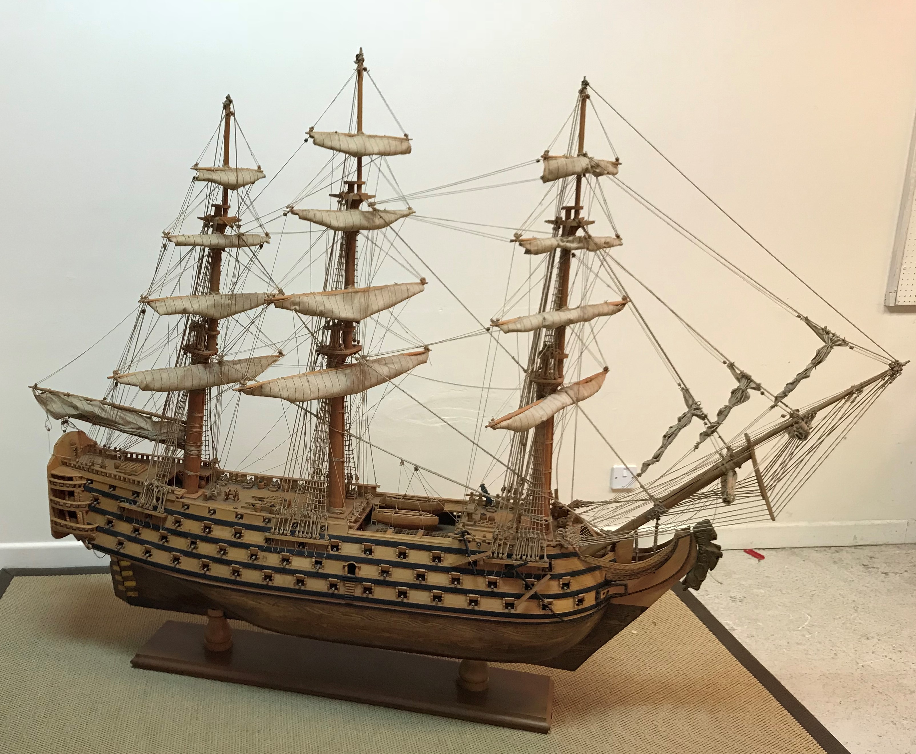 A mid 20th Century craftsman built wooden model of HMS Victory together with copy of Harrods