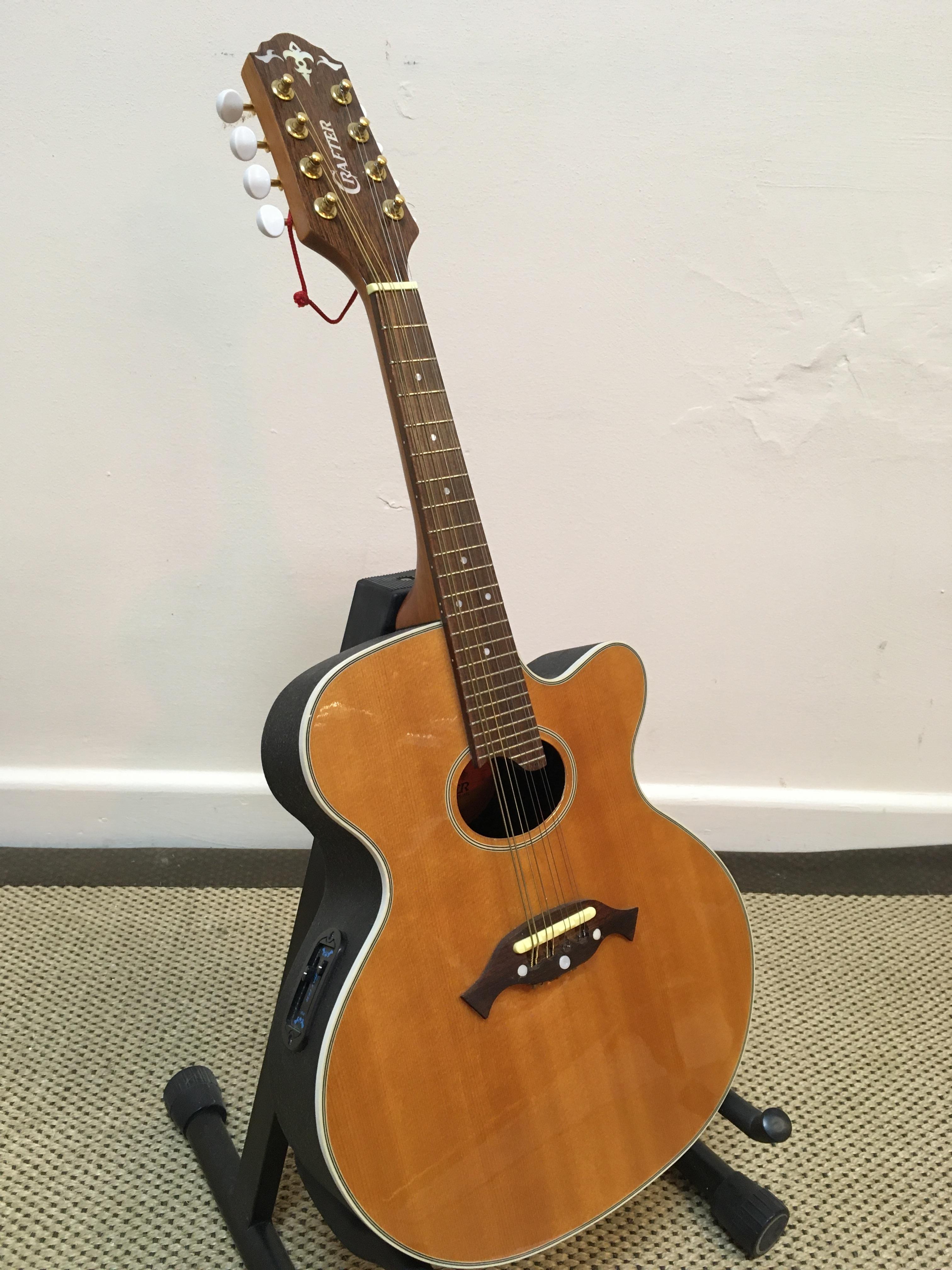 A Crafter model M70E semi acoustic mandolin eight string with cut away guitar body