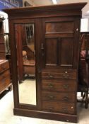 A circa 1900 walnut wardrobe compactum w