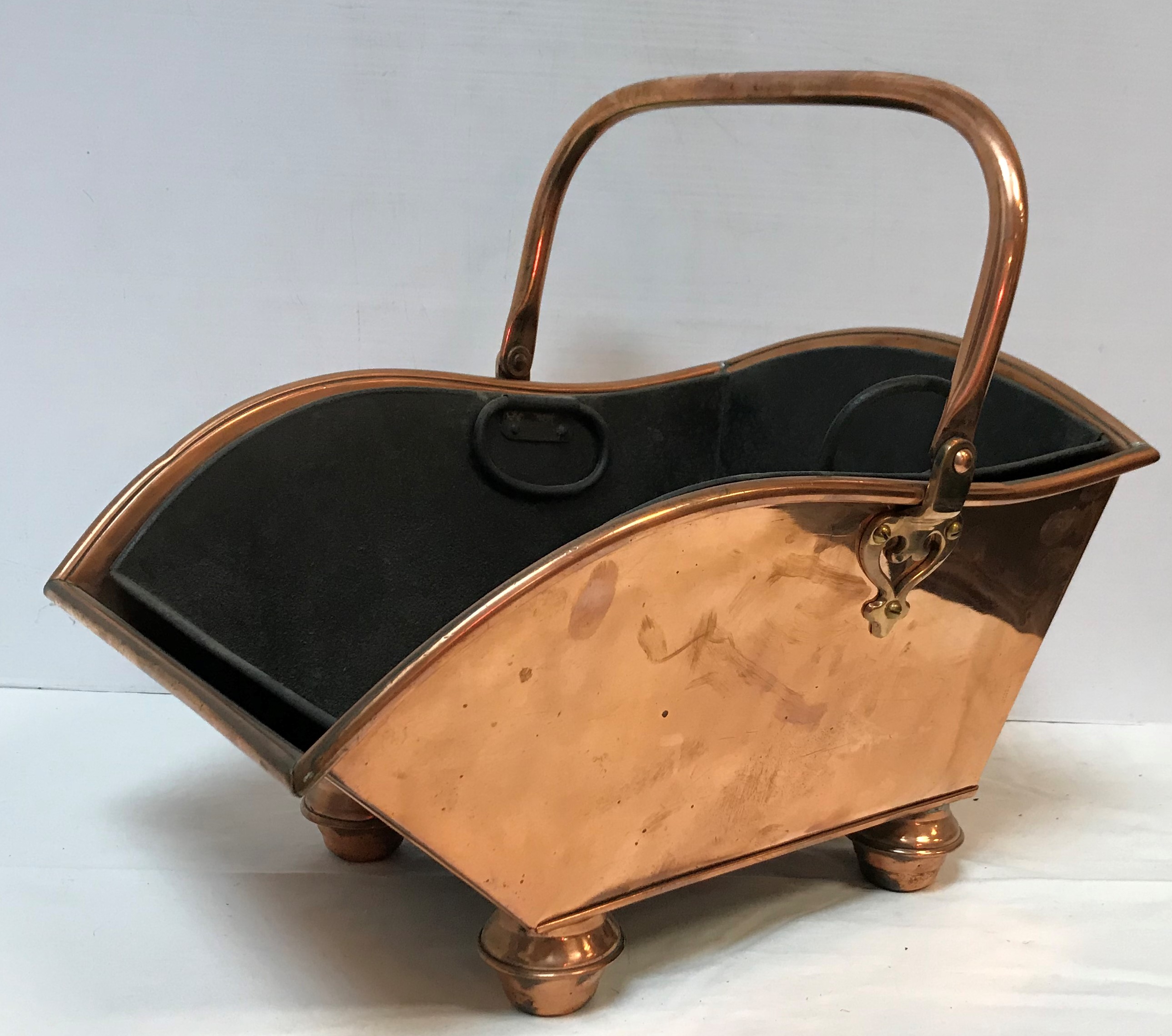 A Victorian copper coal scuttle with swi