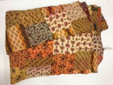 A Neeru Kumar quilted throw in a brown,