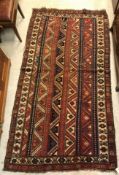 A vintage Caucasian carpet, the central
