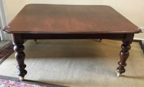 A Victorian mahogany dining table, the r