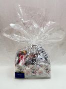 Blooms the Chemist hamper containing perfume, male and female toiletry bags, chocolates, hand