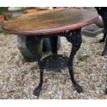 Two cast iron pub tables with wooden tops