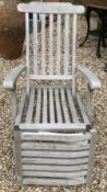 A pair of teak slatted garden steamer type chairs CONDITION REPORTS Have general