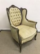 A painted and buttoned upholstered salon armchair in the Louis XV taste,