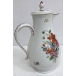 An 18th Century porcelain jug of baluster form, the main body decorated with floral sprays,