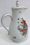 An 18th Century porcelain jug of baluster form, the main body decorated with floral sprays,