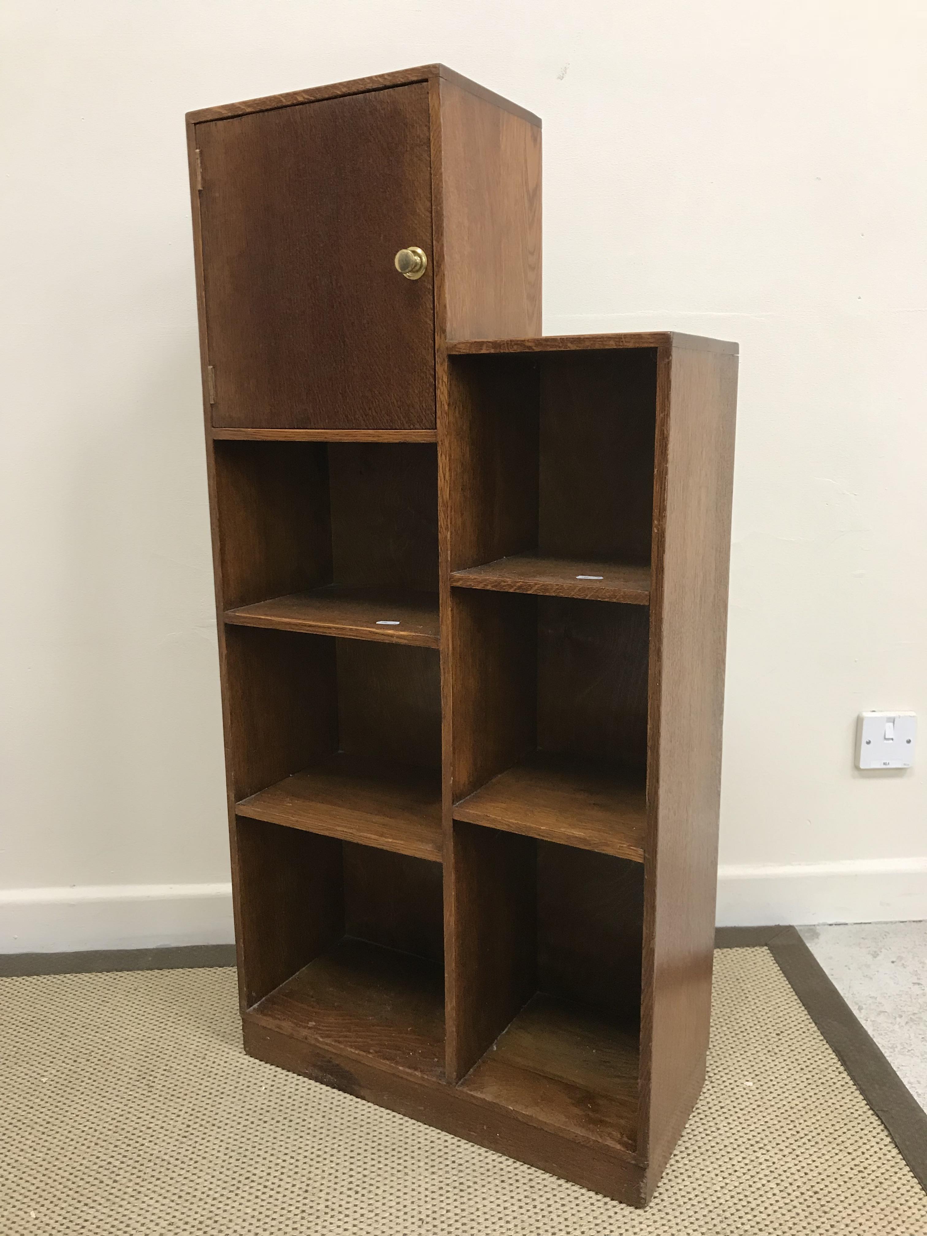 A 1930s Heal's oak dwarf bookcase with single cupboard door over two banks of three shelves, - Bild 2 aus 2