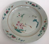 A pair of Chinese famille rose palette chargers decorated with hooded cranes and blossoming foliage,