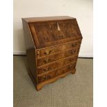 A modern yew wood bureau with fall front above four long drawers 78 cm wide x 43 cm deep x 96 cm