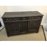 An early 18th Century oak enclosed dresser,