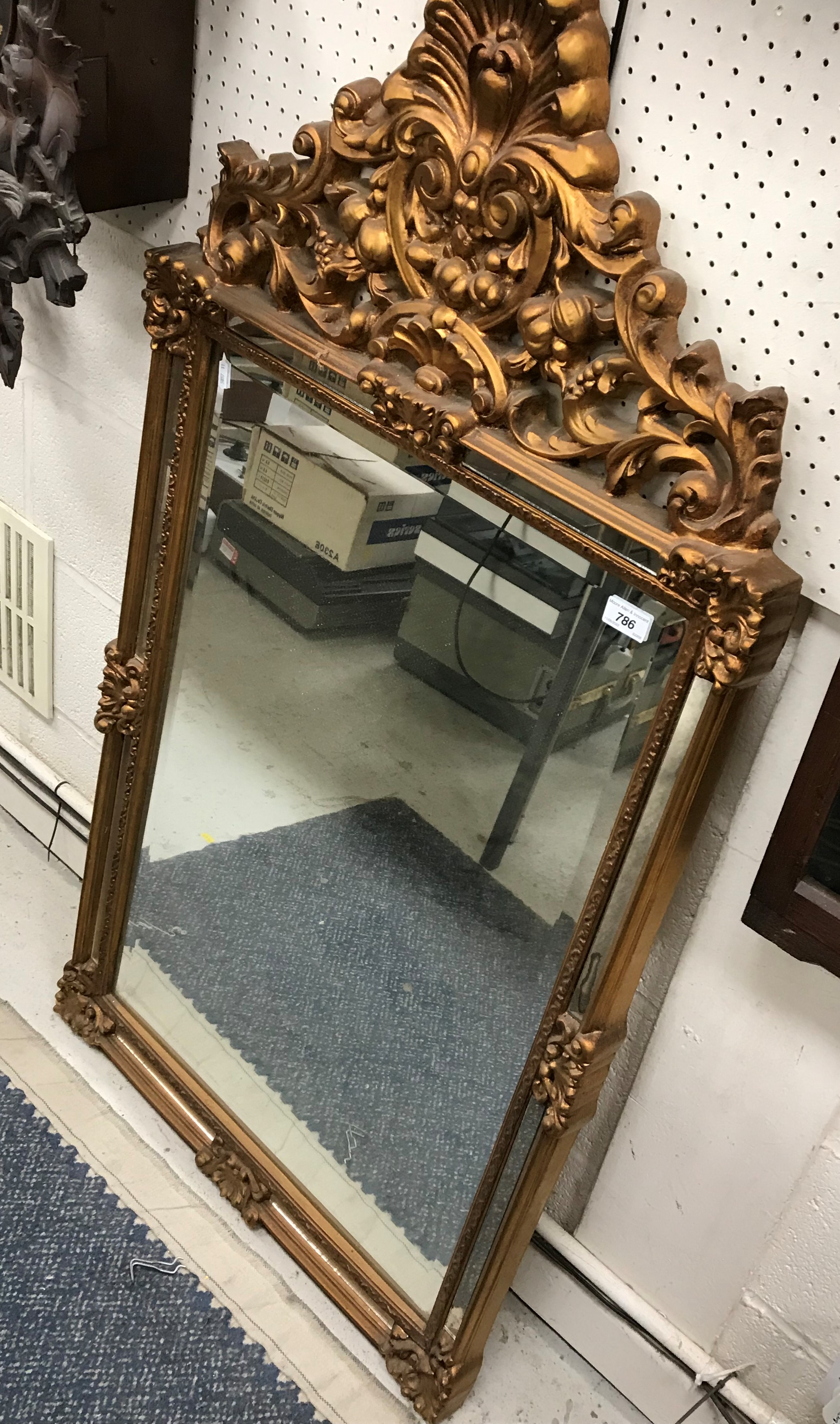 A modern gilt framed wall mirror in the 19th Century manner,