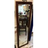 An Edwardian mahogany display cabinet with simulated marquetry inlaid decorated frieze over a