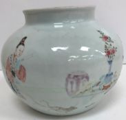 A Chinese Yong Zheng famille-rose jar decorated with a boy playing in a garden with a dog,