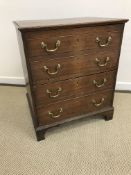 A 19th Century oak commode chest converted to two door cupboard, raised on bracket feet, 63.