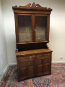 A late Victorian mahogany bookcase cabinet,