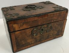 A Victorian Gothic Revival burr walnut and cross banded tea caddy of plain rectangular form,