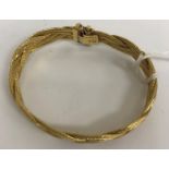 An 18 carat gold bracelet of woven form,