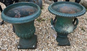 Two similar green cast iron garden urns CONDITION REPORTS Some areas of rusting,