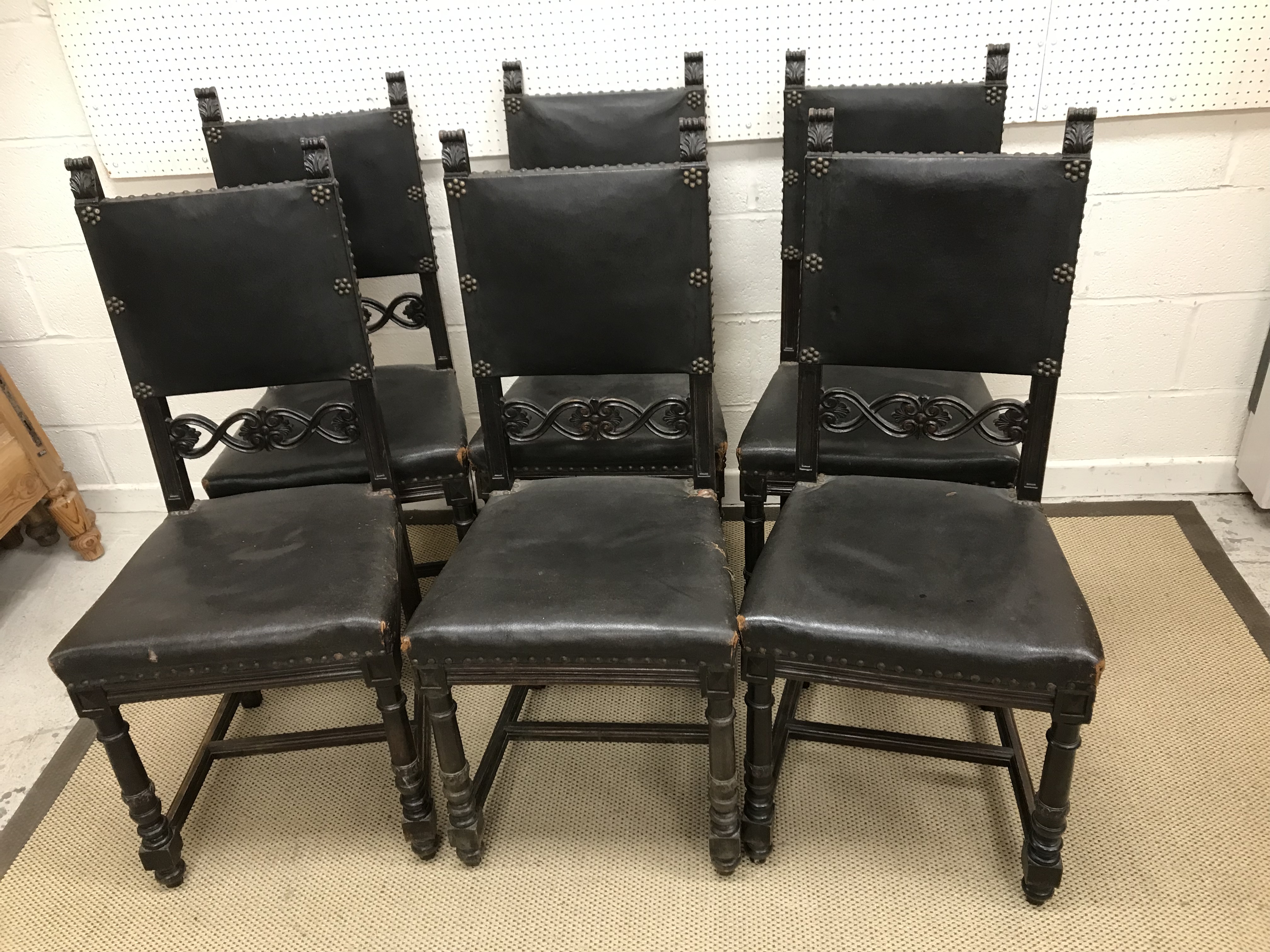 A set of six early 20th Century French dining chairs with leatherette back and seat,