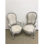 A pair of painted open arm elbow chairs in the Louis XV taste,