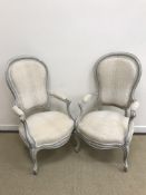 A pair of painted open arm elbow chairs in the Louis XV taste,